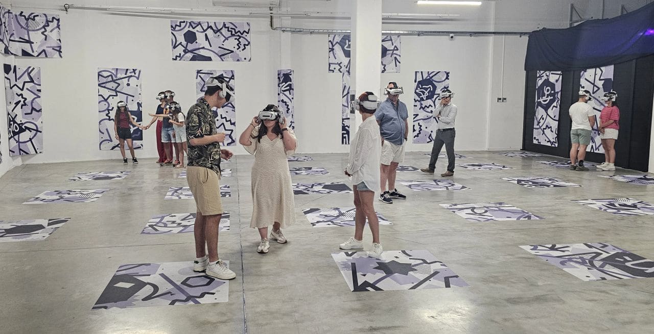 Players wearing wireless VR headsets during The Echo of the Universe at Immersia Lyon